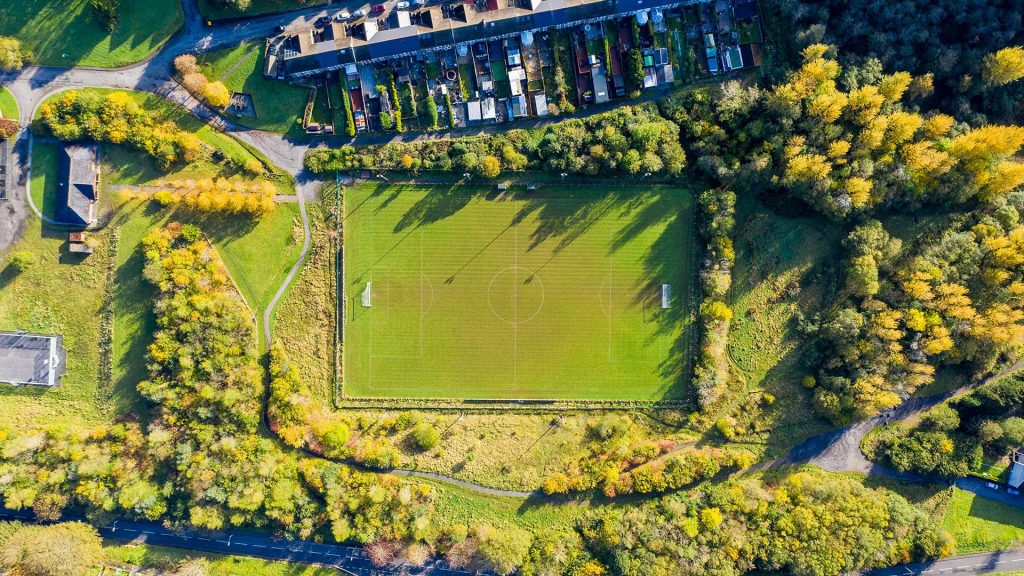 Aerial view of a Soccer Football Pitch in a Rural town in Wales, UK