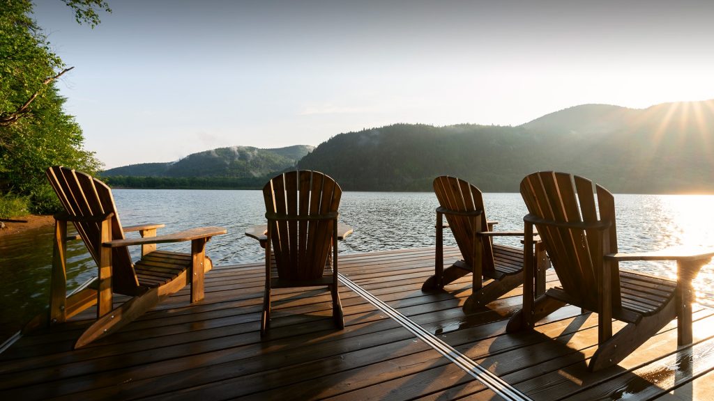 Adirondack deck chairs on lake dock in Parc National du Mont-Tremblant, Lac-Supérieur, Quebec, Canada