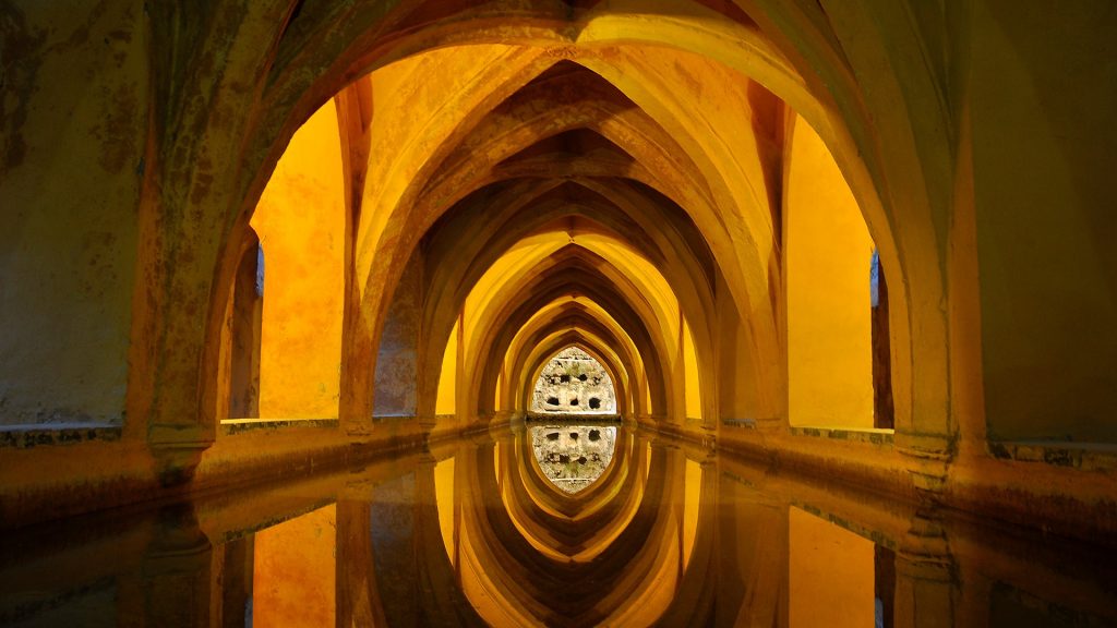 Archs over water, Los Baños de Doña María de Padilla, Alcázar of Seville, Spain