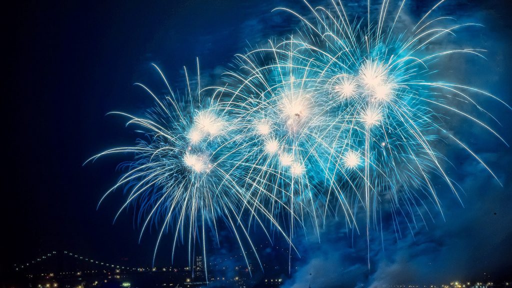 Blue burst fireworks on the East River celebrating Independence Day, New York City, USA