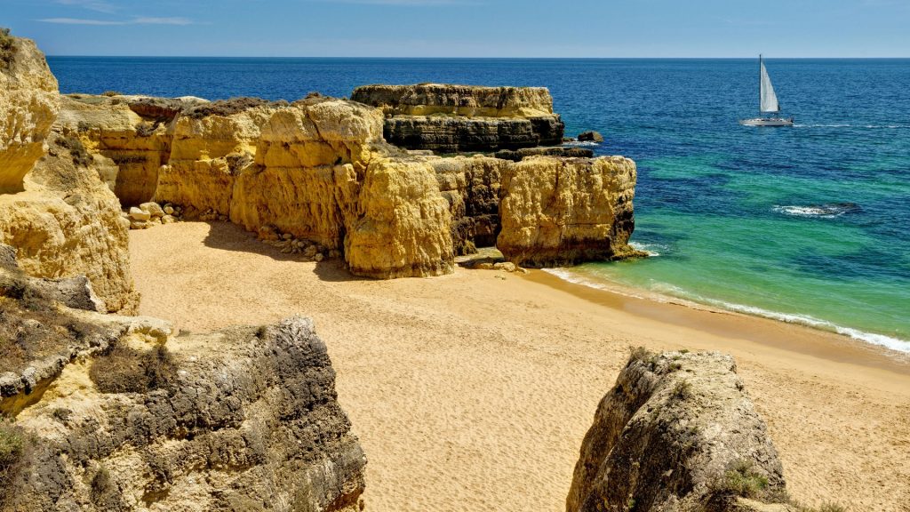 Rock formations and empty beach Praia do Castelo near Albufeira, Algarve, Faro, Portugal