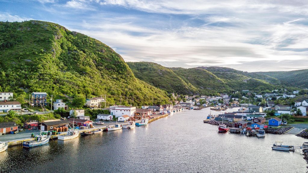 Petty Harbour-Maddox Cove with green hills and wooden architecture, Newfoundland, Canada