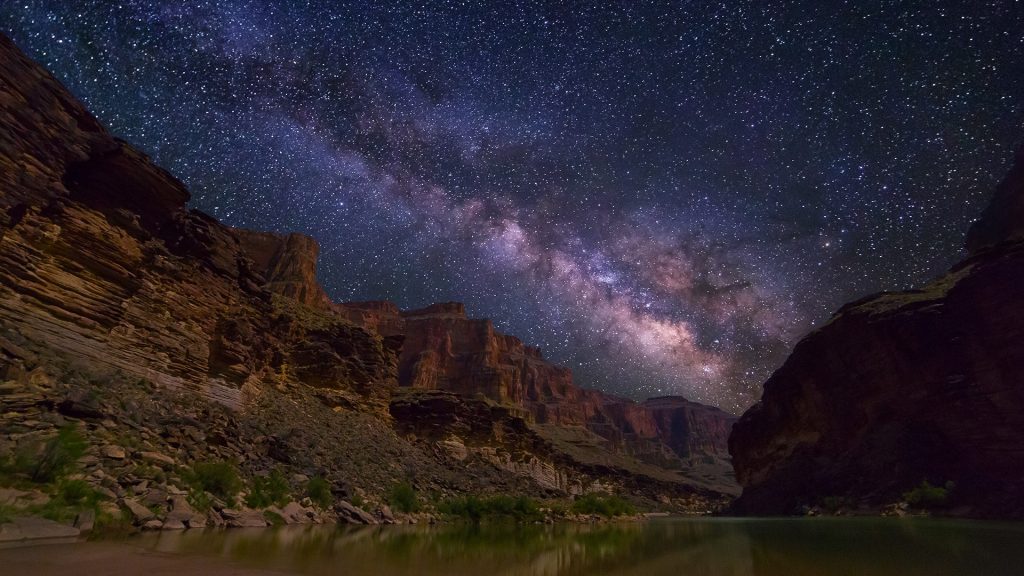 Milky Way spanning over Grand Canyon and Colorado River, Arizona, USA