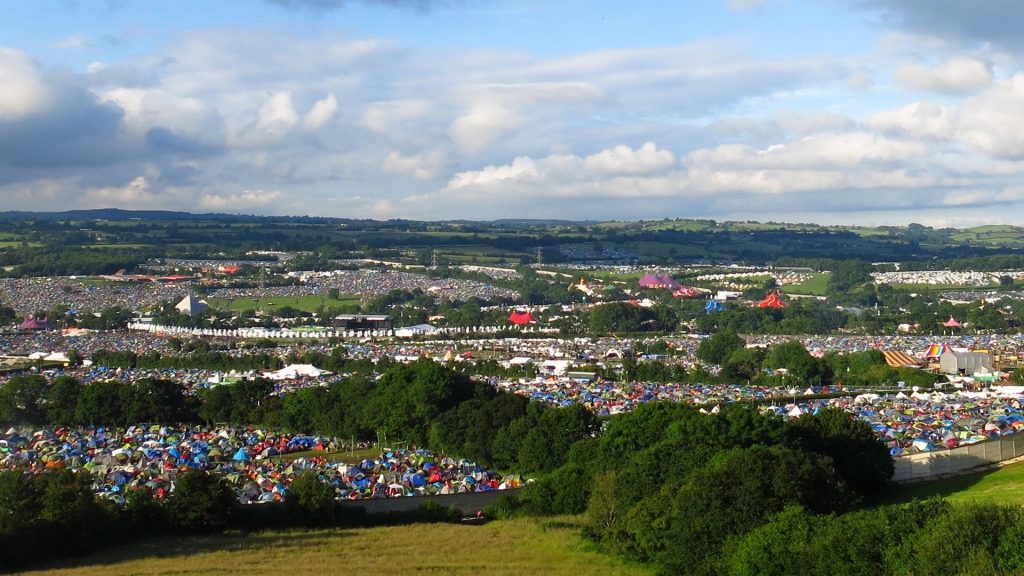 View of Glastonbury Festival from a hillside, Pilton, Somerset, England, UK