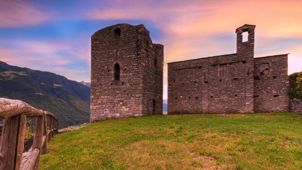 The medieval castle Castello di Domofole at sunset, Mello, Lower Valtellina, Lombardy, Italy