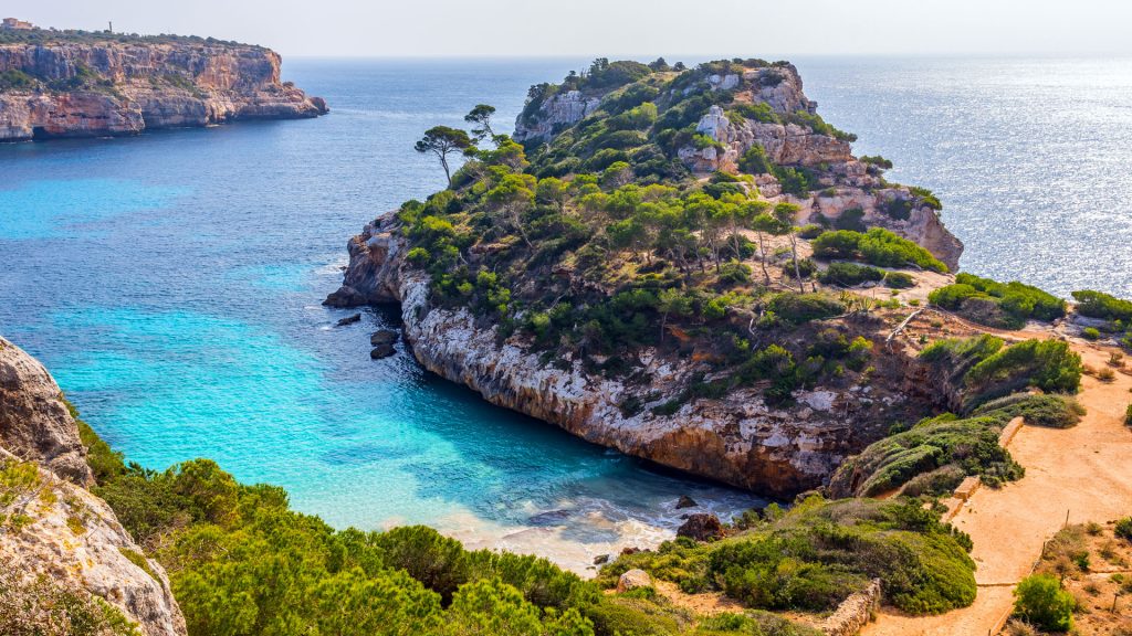 View of the coast next to Caló des Moro beach on a summer sunny day, Mallorca, Spain
