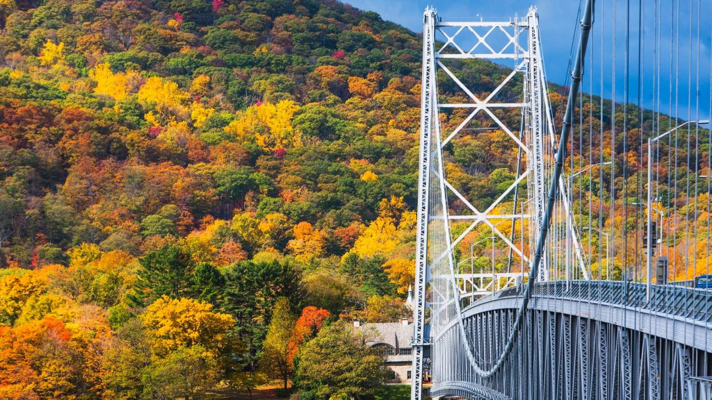 Bear Mountain bridge with colorful autumn trees, New York State, USA