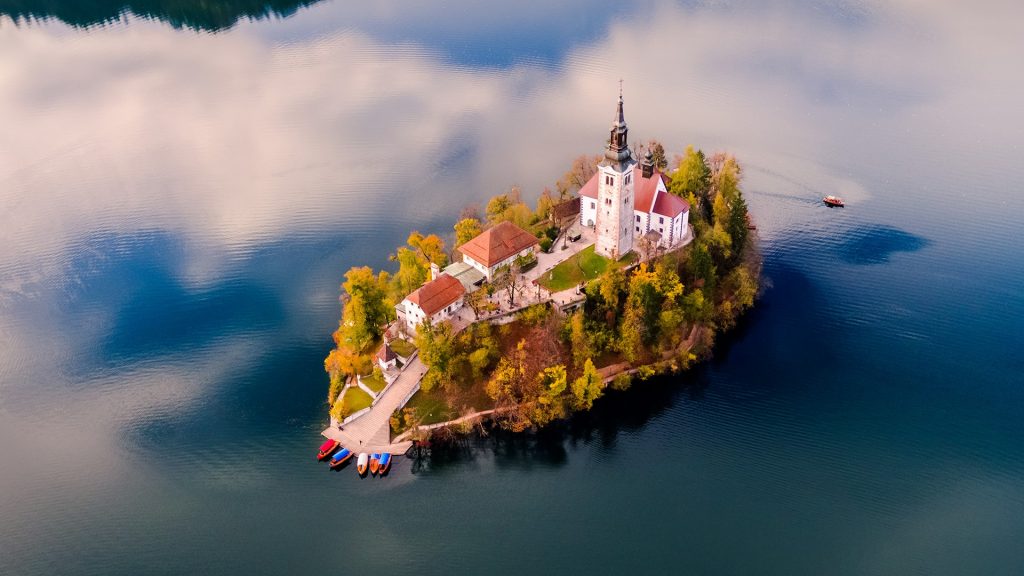 Aerial drone view of Bled island at autumn sunset, Upper Carniola, Slovenia