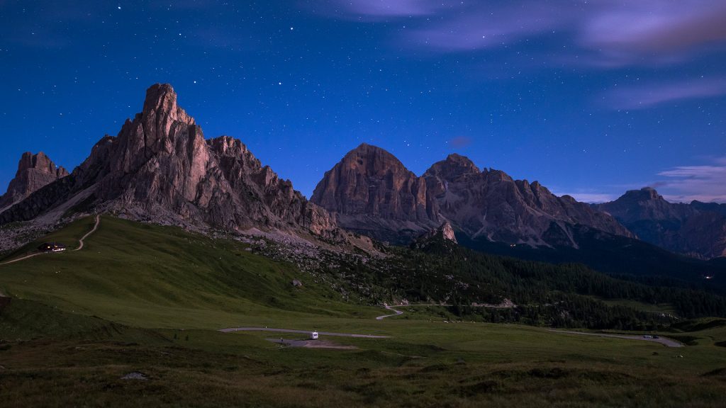 Gusela mountain in a starry night with clouds, Giau Pass, Dolomites, Veneto, Italy