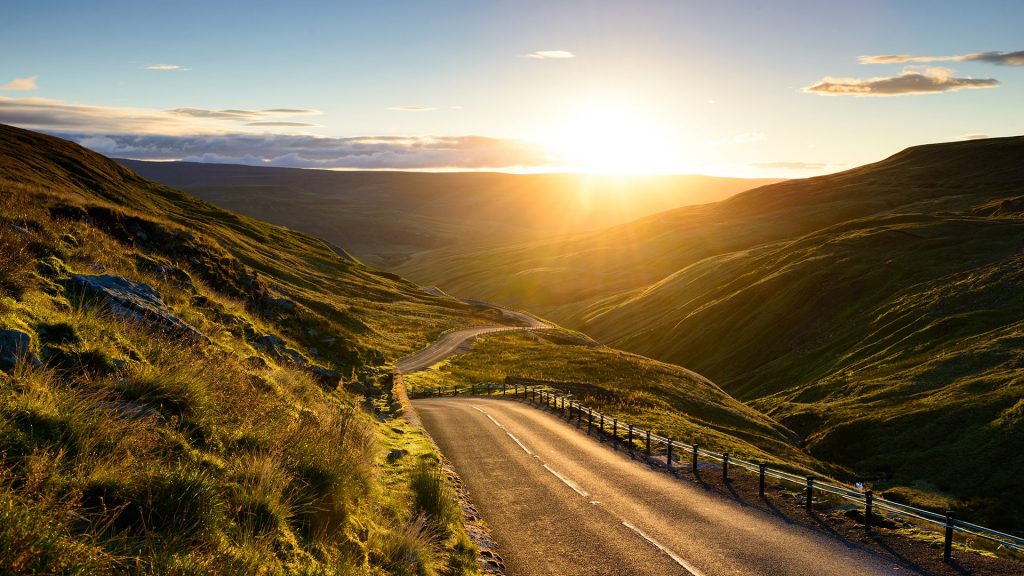 Sunrise over winding mountain road in north Yorkshire, England, UK
