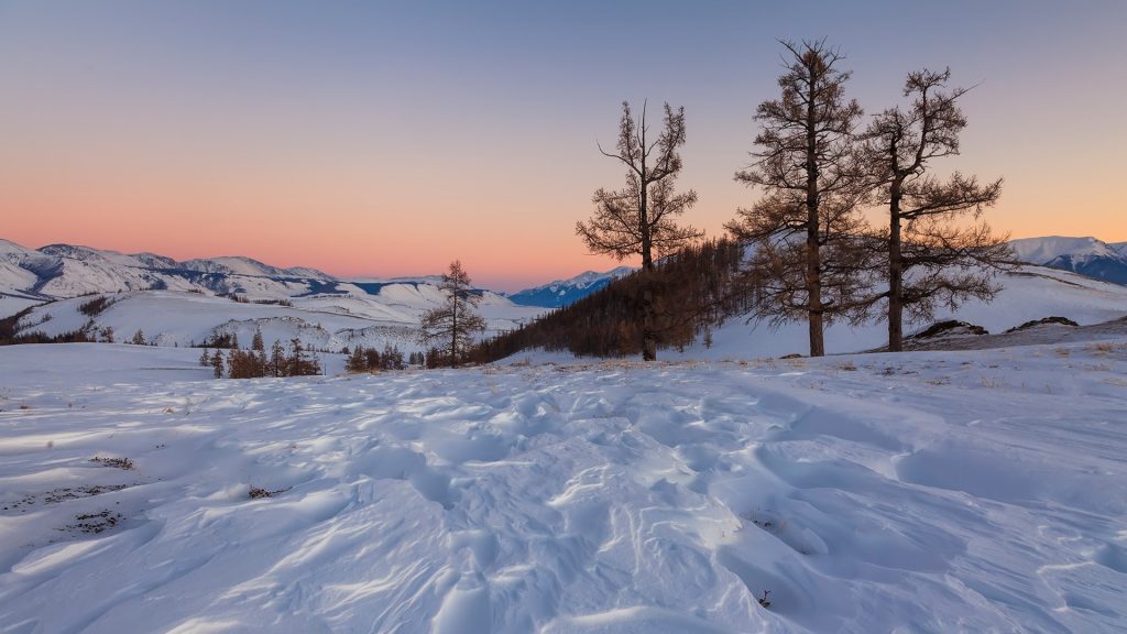 Snowy mountain landscape on the background of a beautiful sunset, Russia