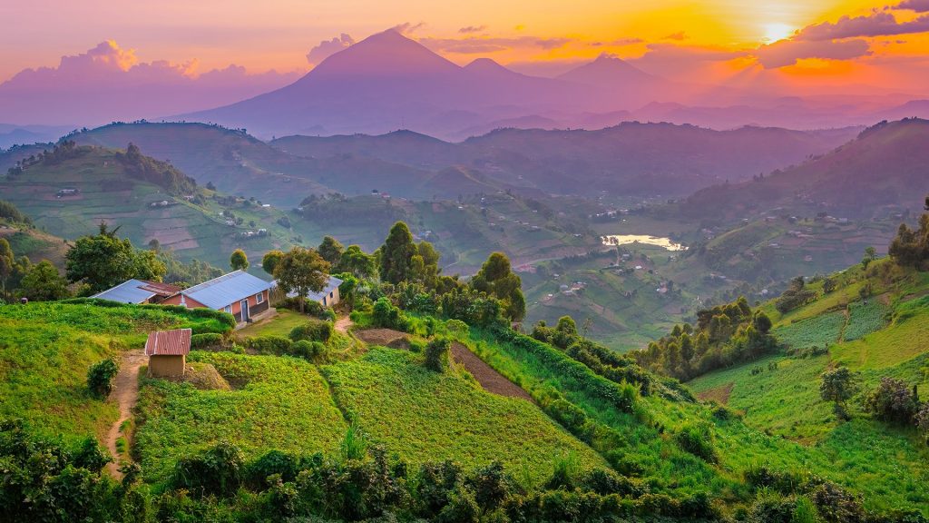 Sunset over mountains and hills of pastures and farms in villages, Kisoro, Uganda
