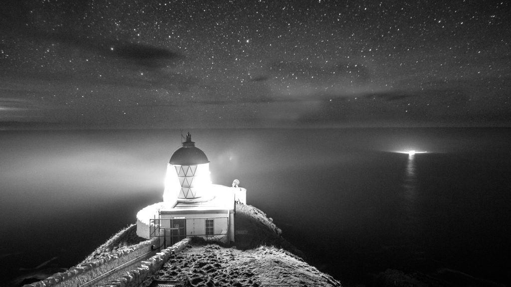High angle view of St Abb's Head Lighthouse at night, Eyemouth, Berwickshire, Scotland, UK