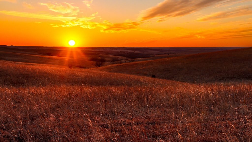 A view of the sunset in the Flint Hills of Kansas just outside of Alma, Kansas, USA