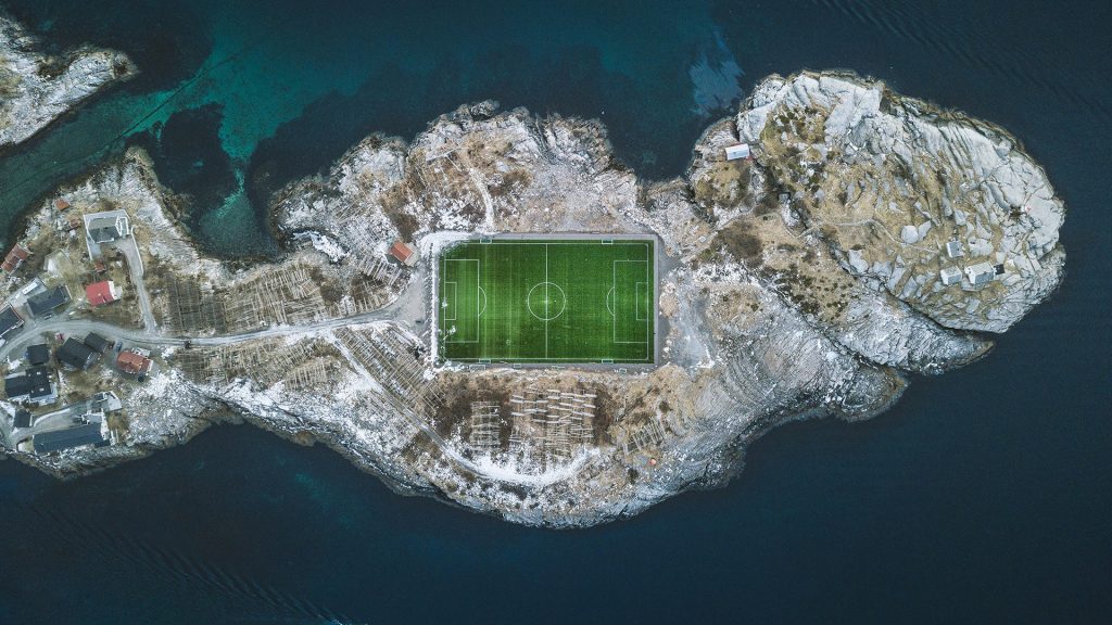 Aerial view of Henningsvær football stadium at the Atlantic Ocean, Lofoten Islands, Norway