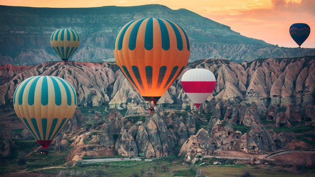 Hot air balloons flying over the valley at Cappadocia, Turkey