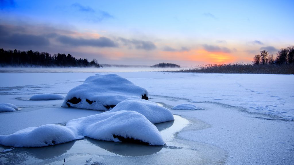 Frozen lake at winter sunset, Tampere, Finland