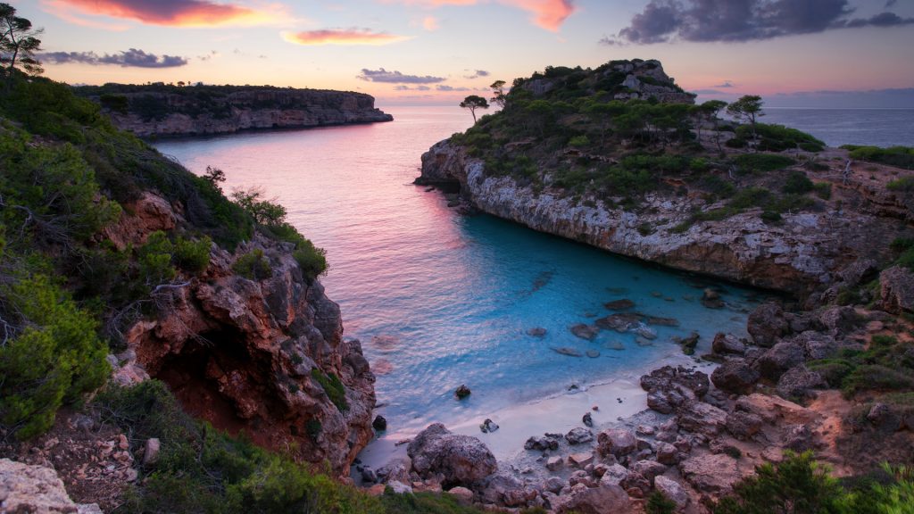 Summer sunrise on a lonely beach, Cala des Moro near Santanyí, Mallorca, Spain