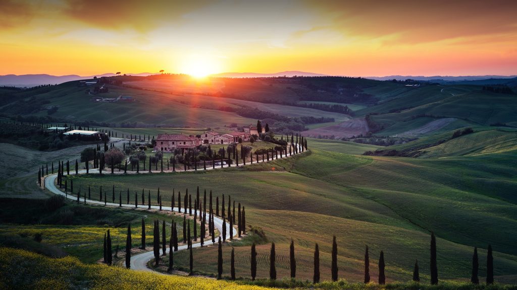 Tuscany landscape with winding country road at sunset, Val D'orcia, Italy