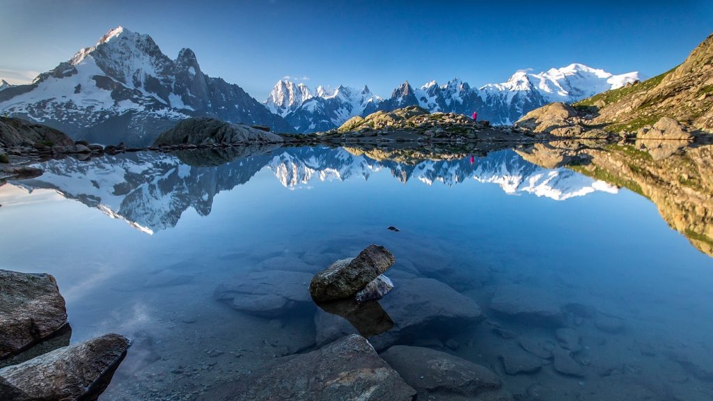 Snowy mountains peaks reflected in Lac Blanc, Haute Savoie, Chamonix, Mont Blanc, France
