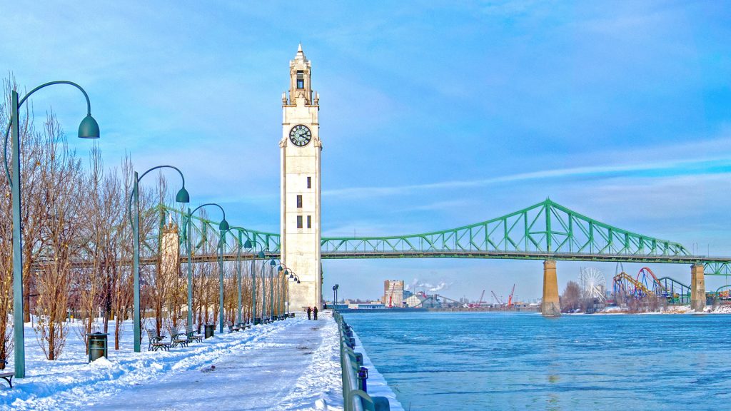 St. Lawrence River with Big Ben and Jacques-Cartier Bridge in Old Montreal, Quebec, Canada