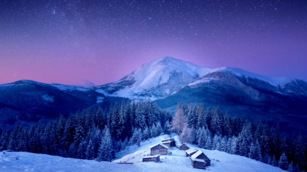 A small village in the Carpathian Mountains behind Petros Mountain under Milky Way, Ukraine