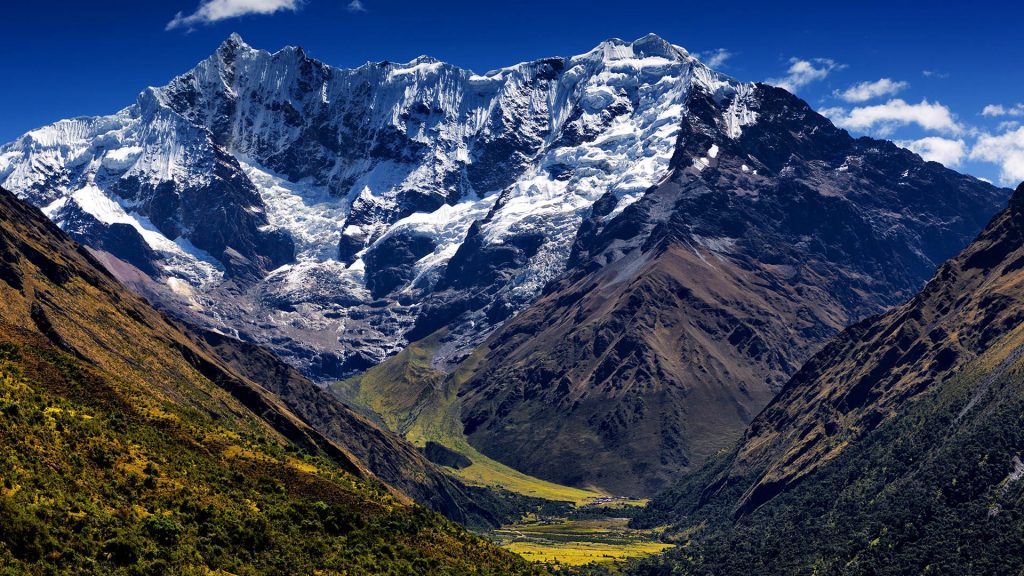 Snowcapped Salkantay mountain towers over valley in autumn afternoon, Peru
