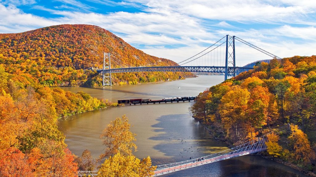 Bear Mountain bridge on Hudson river during peak fall season, Fort Montgomery, New York, USA