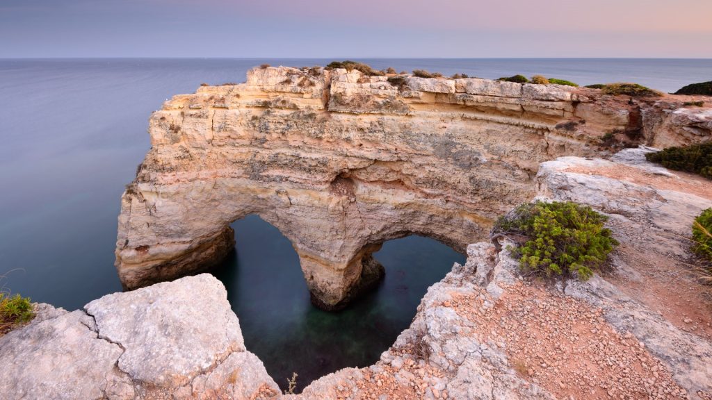 Heart-shaped rock on Praia da Marinha beach on the southern coast, Lagoa, Algarve, Portugal