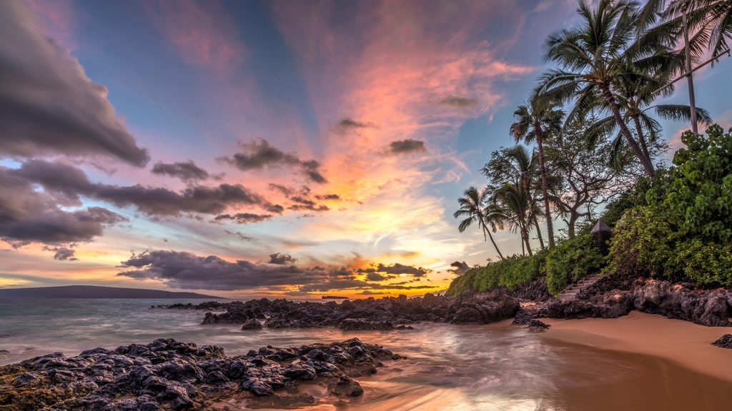Colourful sunset at Secret Cove Beach, Maui, Hawaii, USA