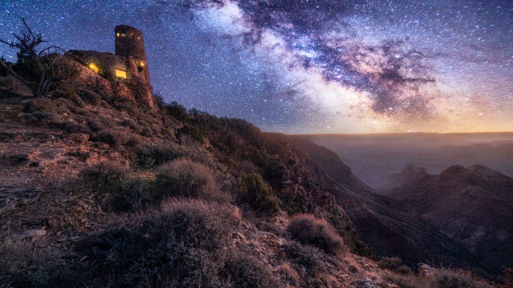 Grand Canyon desert view watchtower at night with Milky Way, Arizona, USA