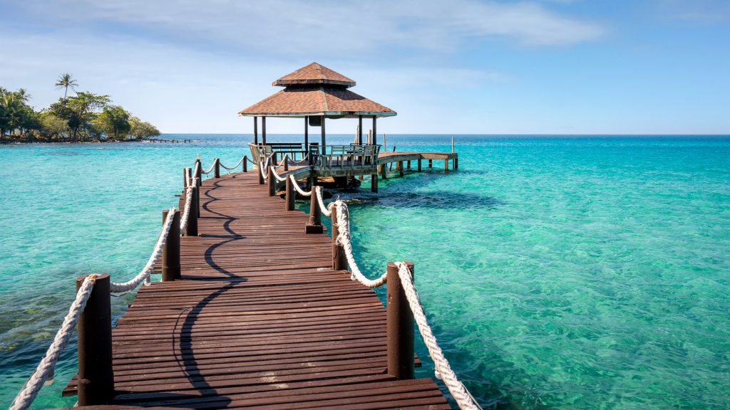 Wooden bar in sea and hut with nice blue sky in Koh Kood at Trat, Thailand