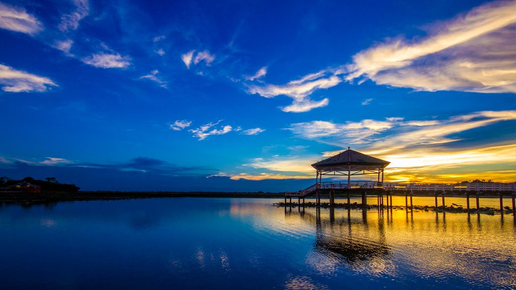 Sunset twilight at the reservoir with pavilion, Bueng Si Fai, Phichit, Thailand