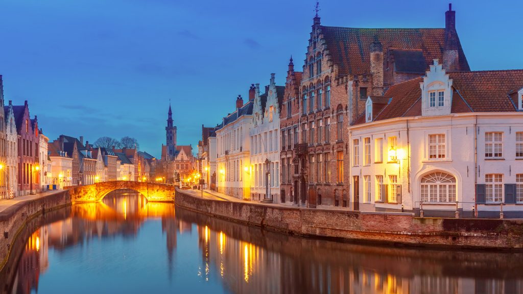 Night cityscape with views of Spiegelrei and Jan van Eyckplein in Bruges, Belgium