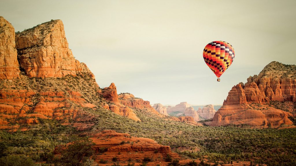 Hot air balloon flying over Sedona in Arizona, USA