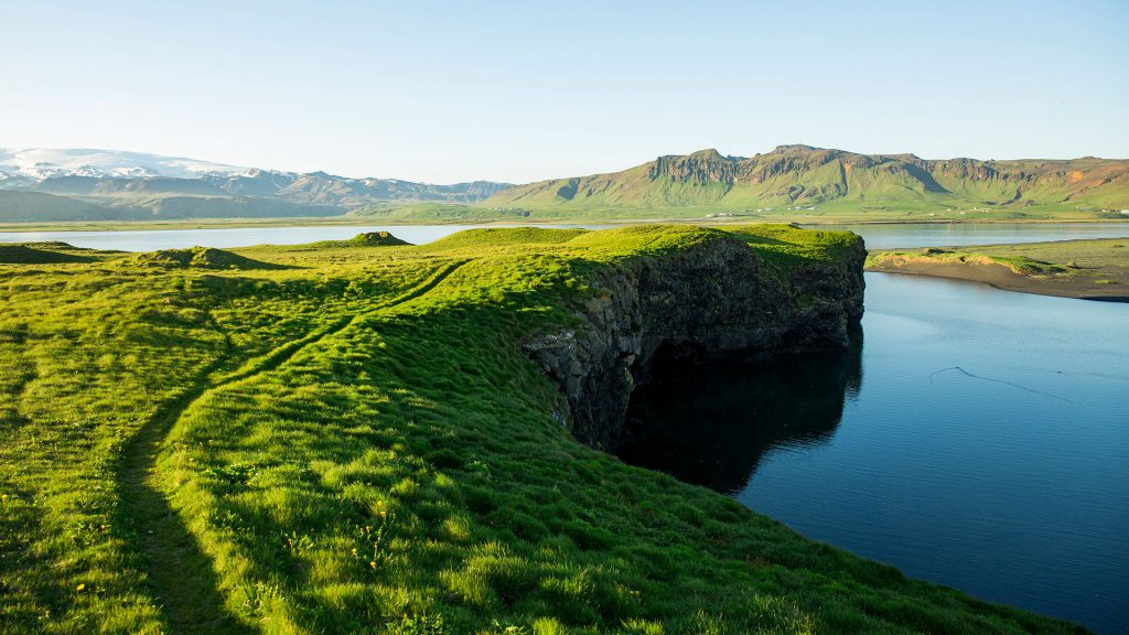 A lush scenic trail along a lagoon, Dyrhólaey, Iceland