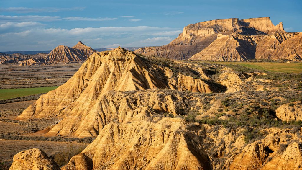 View of rough mountainous cliffs in bad land terrain of Bardenas Reales, Navarre, Spain