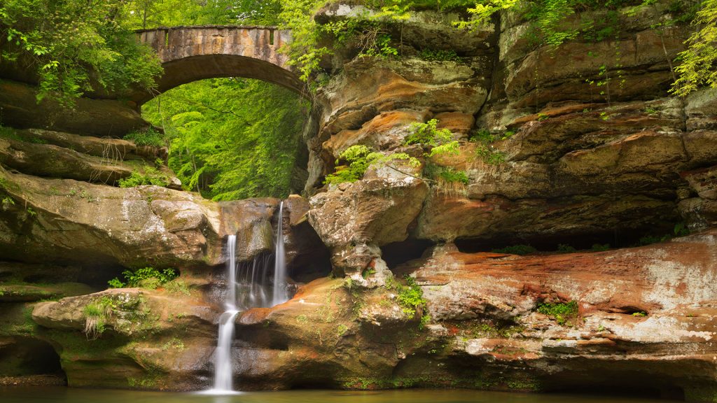 The Upper Falls waterfall and bridge in Hocking Hills State Park, Ohio, USA