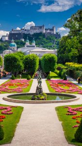 Mirabell Palace and Gardens in summer, Salzburg castle in background ...