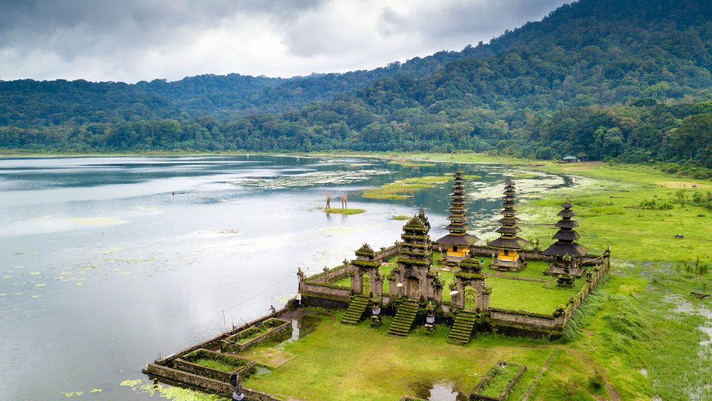 Aerial view of hindu temple ruins of Pura Hulun Danu at the Tamblingan lake, Bali, Indonesia