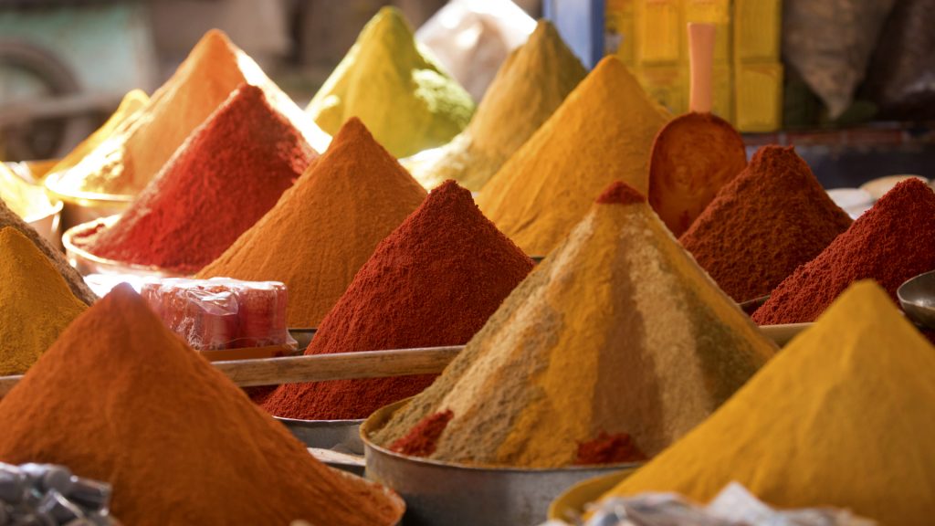 Display of spices in piles for sale in market, Medina of Fez, Morocco