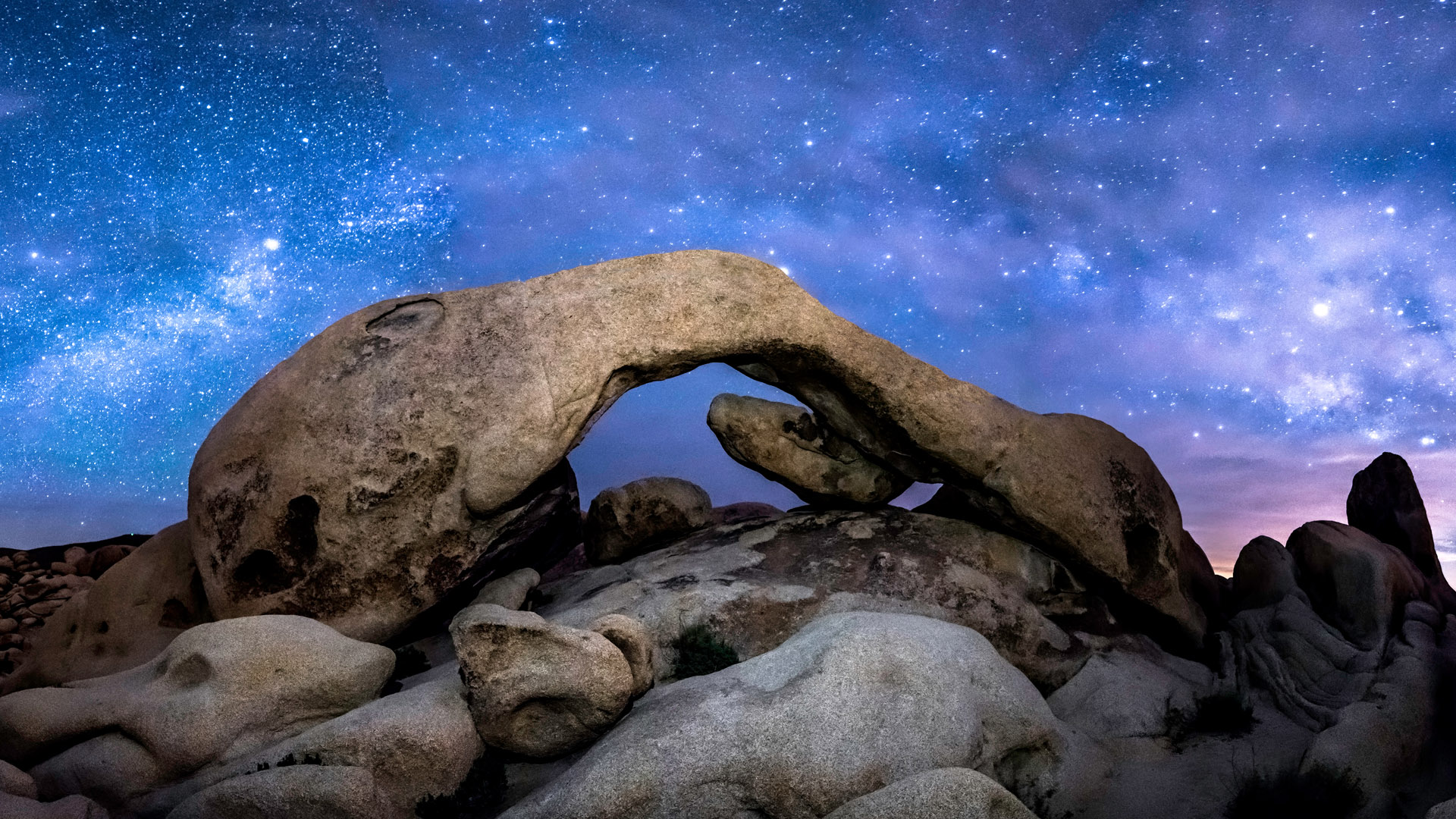 The Milky Way formed over Arch Rock in Joshua Tree National Park ...