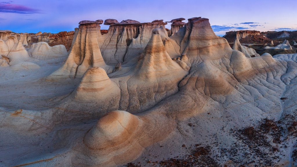 Hoodoos of Bisti Badlands in De-Na-Zin Wilderness at sunset, New Mexico, USA