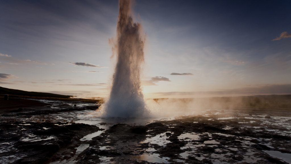 Rising Sun Lights Boiling Water Erupting From Strokkur Geyser On Summer 