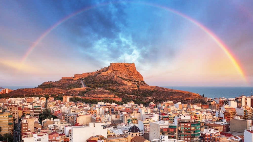 Alicante view with Santa Bárbara Castle on Mount Benacantil at sunset with rainbow, Spain