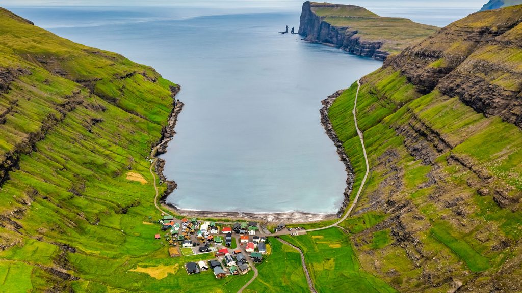 Aerial view of a small town Tjørnuvík on the Atlantic Ocean, Faroe islands, Denmark