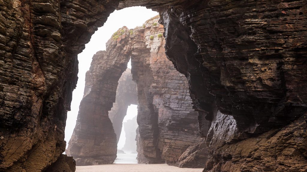 Natural rock arches on Cathedrals beach in low tide, Praia As Catedrais, Ribadeo, Spain