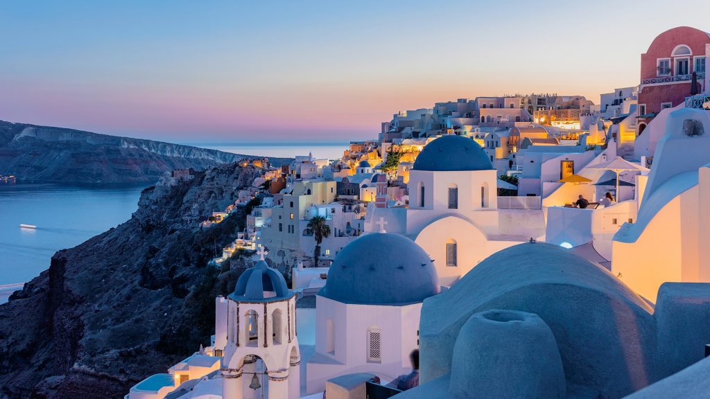 Houses and churches in twilight after sunset, Oia, Santorini Island, Cyclades, Greece