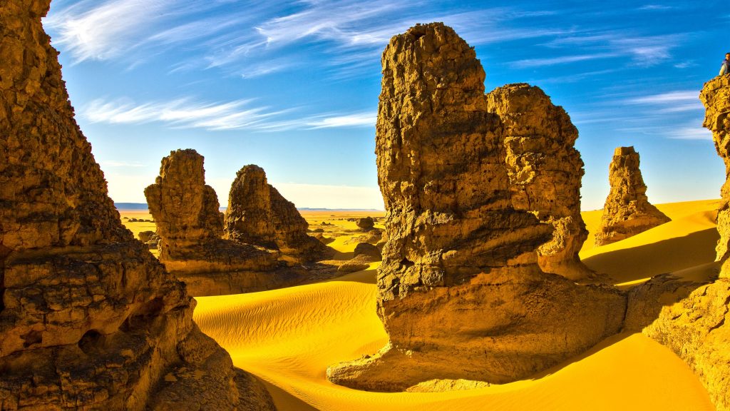 Rocks with sand dunes in Sahara Desert, Algeria