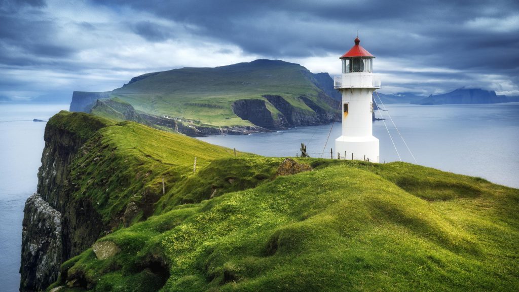 Mykines Hólmur Lighthouse on a stormy summer day, Faroe Islands, Denmark